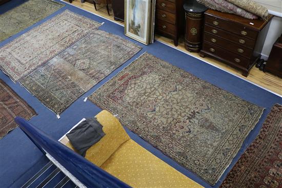 Five Persian rugs